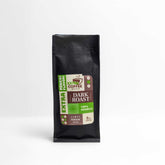 Black bag of Dark Roast Coffee with 100% Arabica premium blend label and extra flavor branding