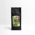 Black bag of Dark Roast Coffee with 100% Arabica premium blend label and extra flavor branding