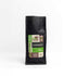 Black bag of 100% Arabica espresso coffee with premium blend label and 8 oz weight